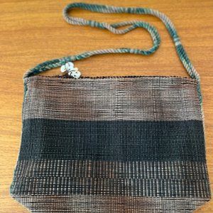 Woven handbag in brown and blue/turquoise.